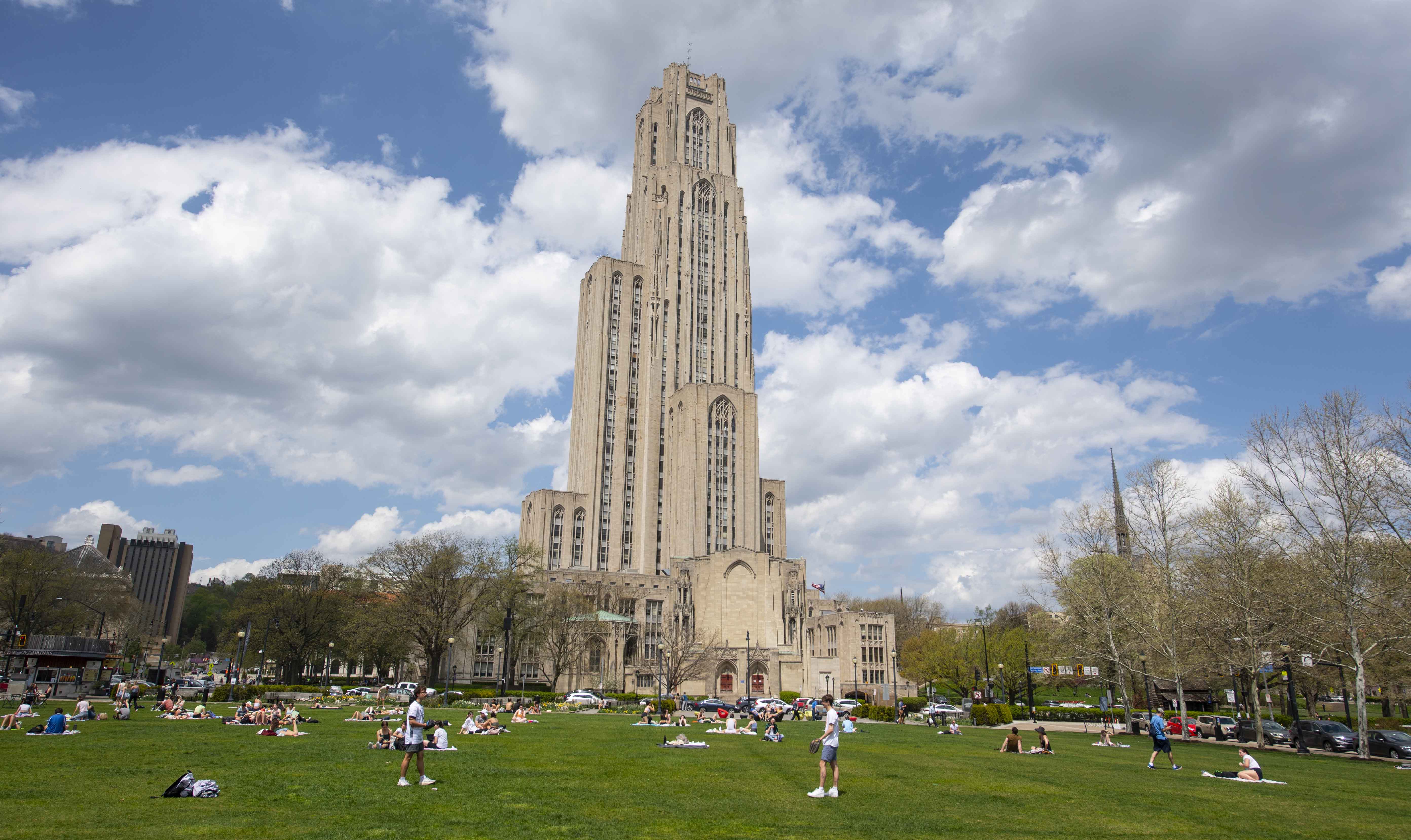 Schenley Plaza is owned by the city and overseen by the Pittsburgh Parks Conservancy, but its proximity to the Pitt campus has made it a popular hang out for students, staff and faculty. (Aimee Obidzinski | University of Pittsburgh) Schenley Plaza lawn and Cathedral of Learning